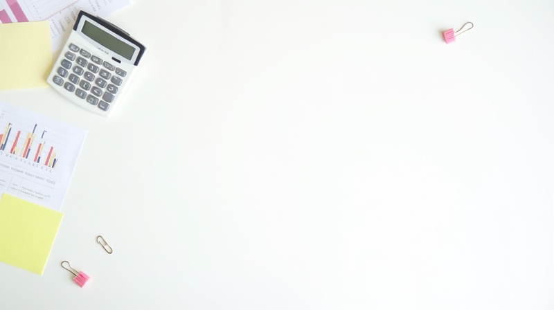 Office desk with supplies and printed materials